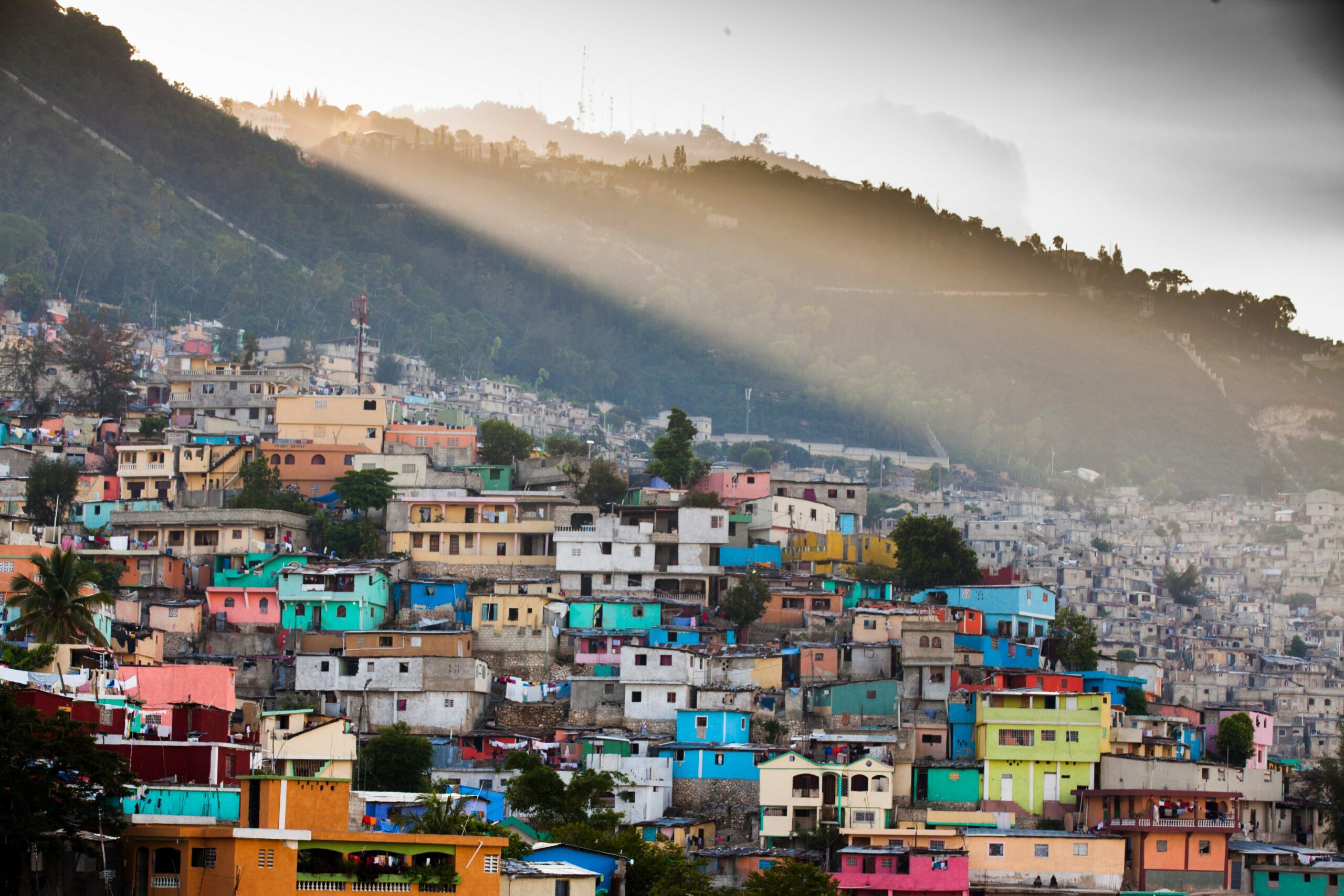 A dense hillside community representing global informal settlements