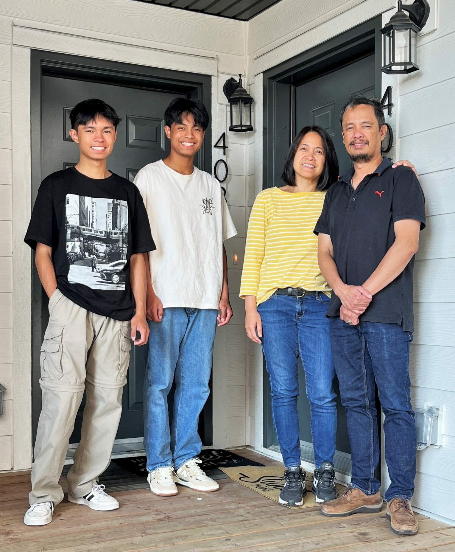 Family in front of home