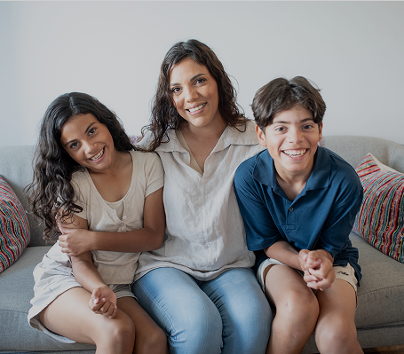 Diana and her children sitting on a sofa
